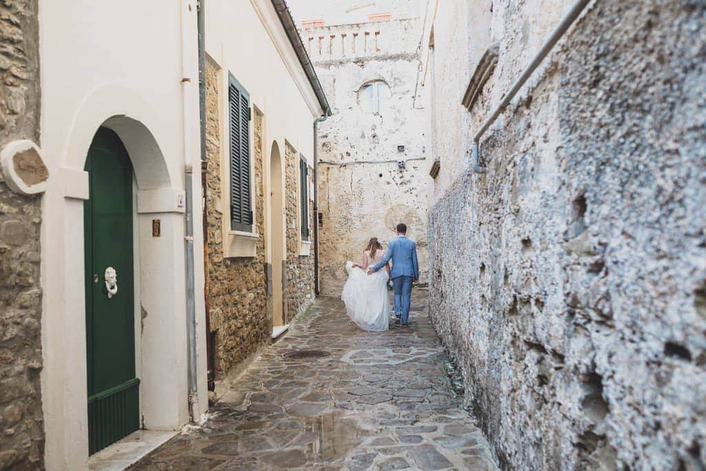 italy wedding photographer bride boho and blue suit relaxed